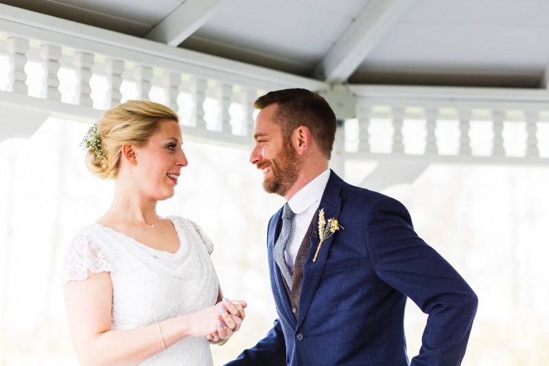 Duncan &amp; Karen smile at each other during their ceremony