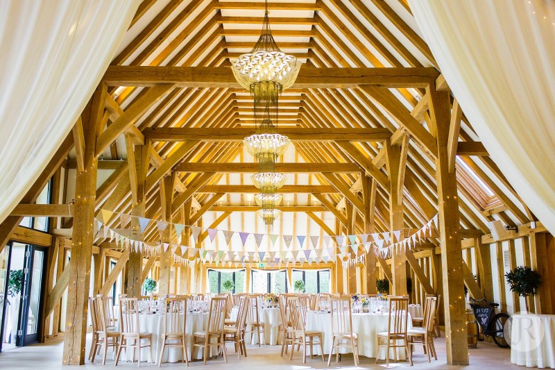 The Old Kent Barn interior decorated for the wedding reception