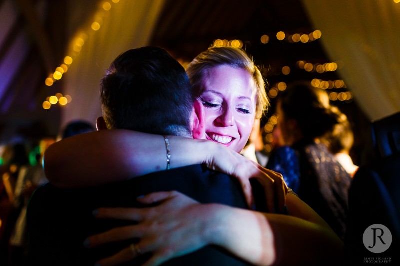 Karen hugs friend at the wedding reception