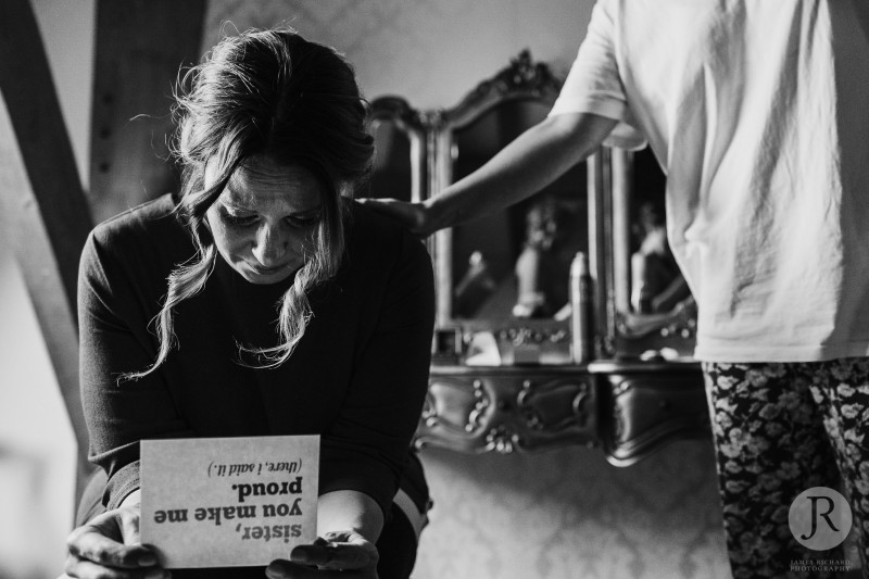 The bride's sister cries as she reads letter from the bride