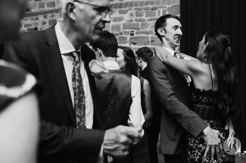 Guests pulling funny faces whilst dancing