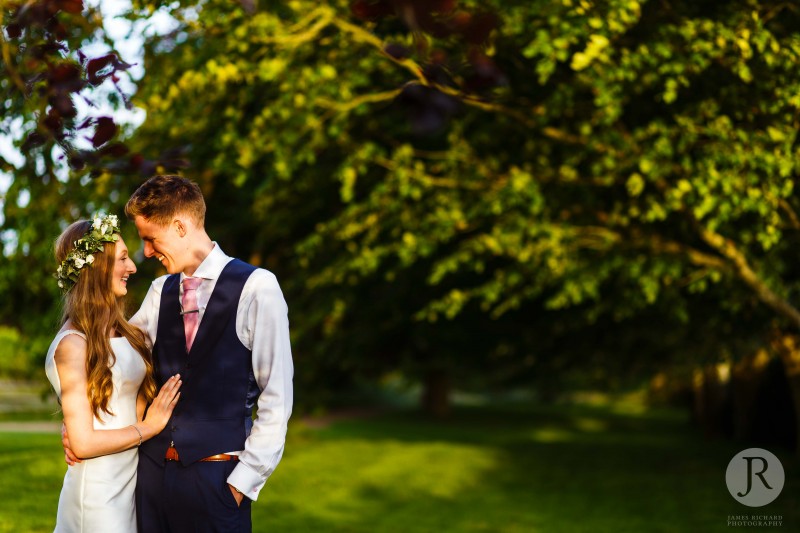 Couple looking into each other's eyes as the sun sets