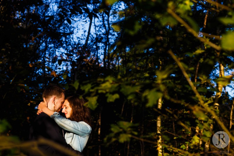 Young couple hug each other during their engagement photos